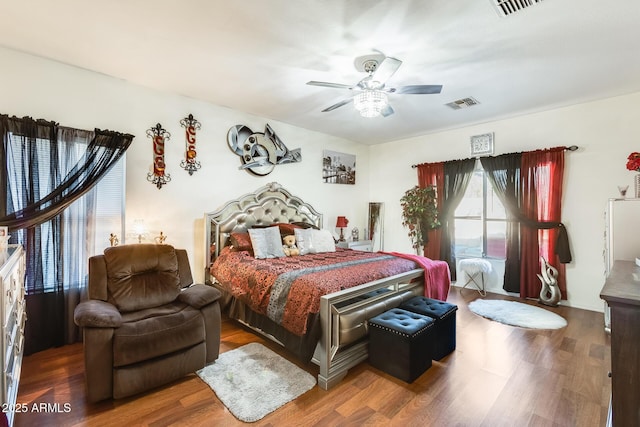 bedroom featuring ceiling fan and dark hardwood / wood-style flooring