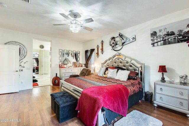 bedroom with ceiling fan and dark hardwood / wood-style flooring