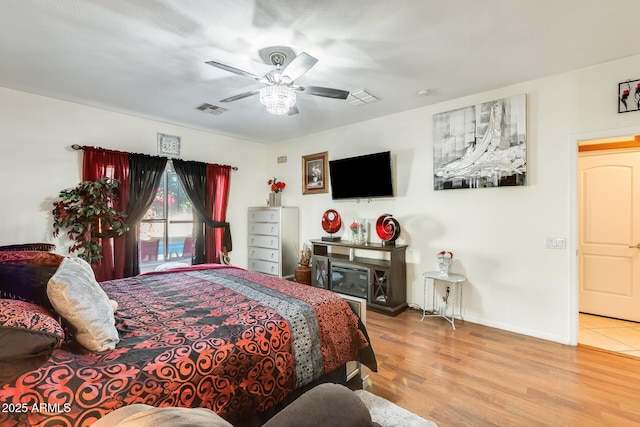 bedroom featuring ceiling fan and light hardwood / wood-style floors