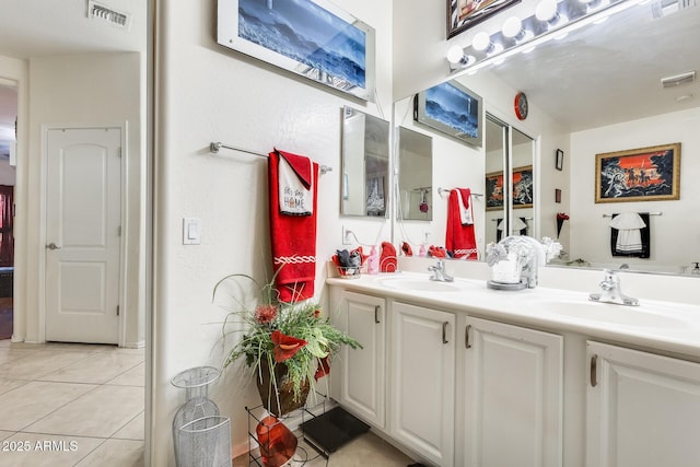 bathroom with vanity and tile patterned flooring