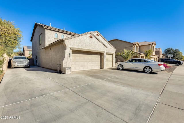 view of side of property with a garage