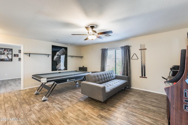 rec room with ceiling fan and wood-type flooring