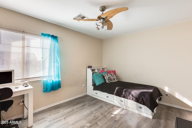 bedroom featuring ceiling fan and light wood-type flooring