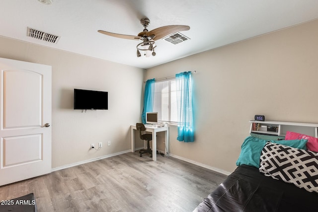 interior space featuring wood-type flooring and ceiling fan