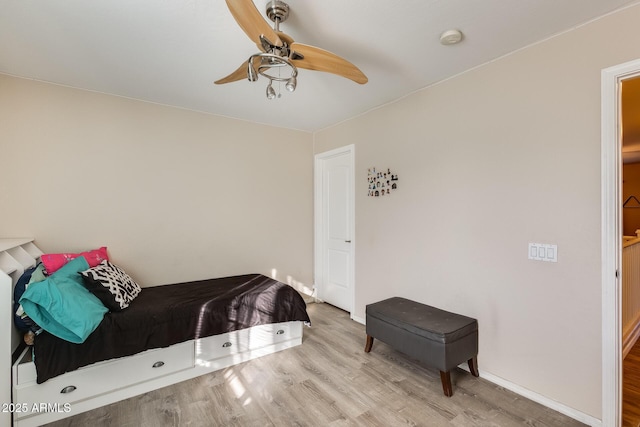 bedroom featuring ceiling fan and light wood-type flooring