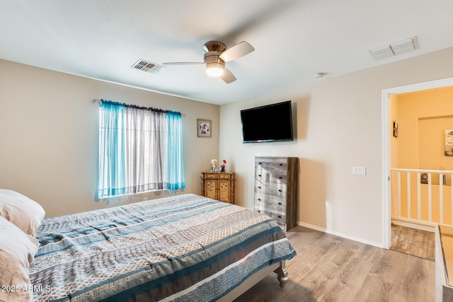 bedroom featuring ceiling fan and light hardwood / wood-style flooring