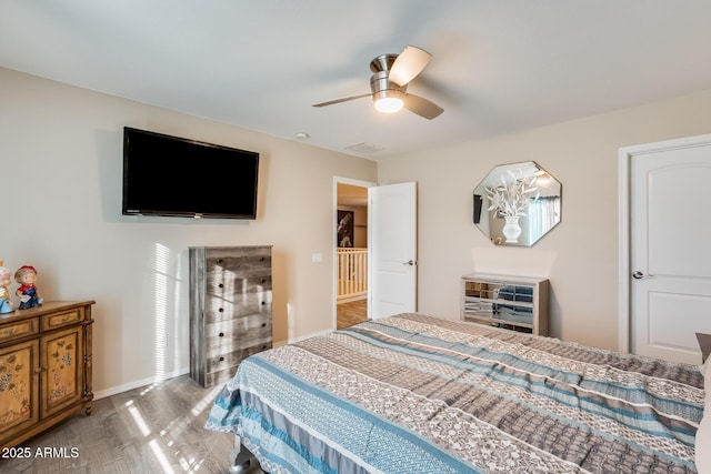 bedroom featuring ceiling fan and hardwood / wood-style floors