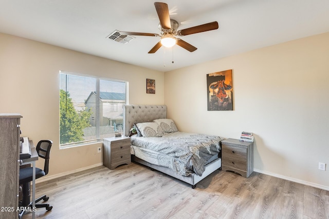 bedroom featuring light hardwood / wood-style floors and ceiling fan