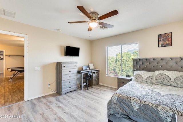 bedroom with ceiling fan and light hardwood / wood-style flooring