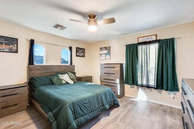 bedroom with ceiling fan and light hardwood / wood-style flooring