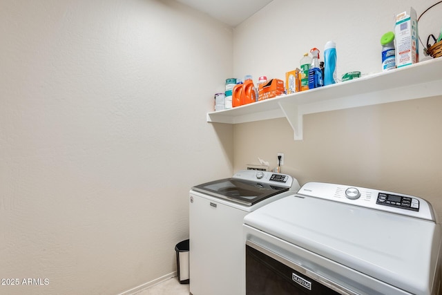 clothes washing area featuring separate washer and dryer