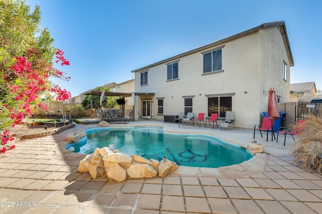 view of swimming pool with a patio and exterior bar