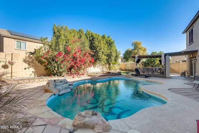 view of swimming pool with a patio area and a bar