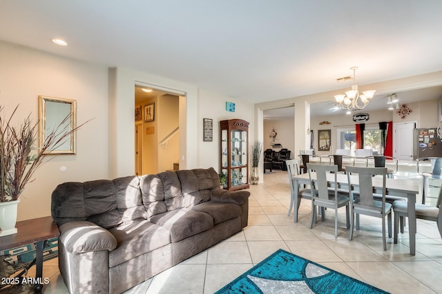 living room featuring light tile patterned floors and a chandelier