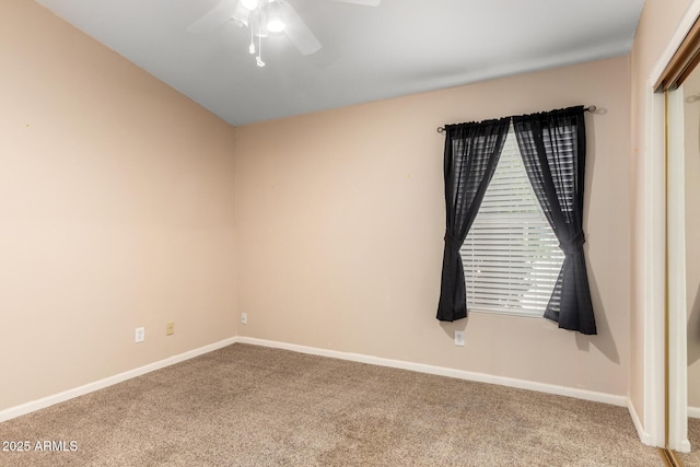 unfurnished room featuring carpet, baseboards, and ceiling fan