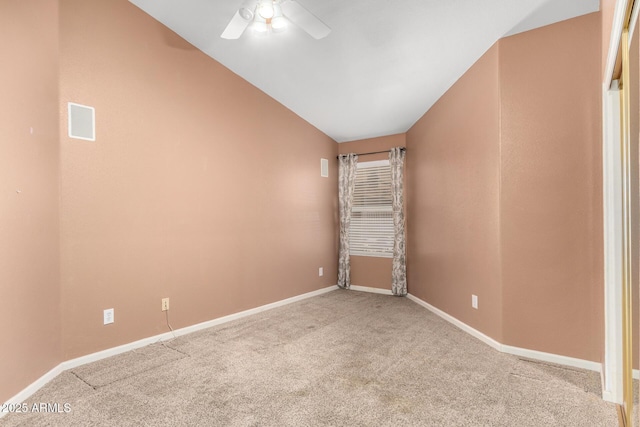 carpeted empty room featuring baseboards and ceiling fan