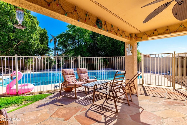 view of patio featuring a fenced in pool and fence