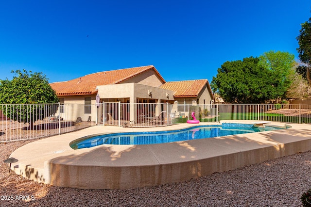 view of pool with a patio area, a fenced in pool, and fence