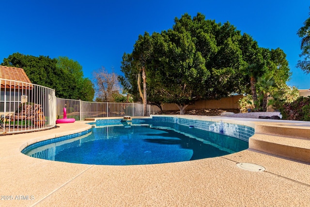 view of swimming pool featuring a fenced in pool and a fenced backyard