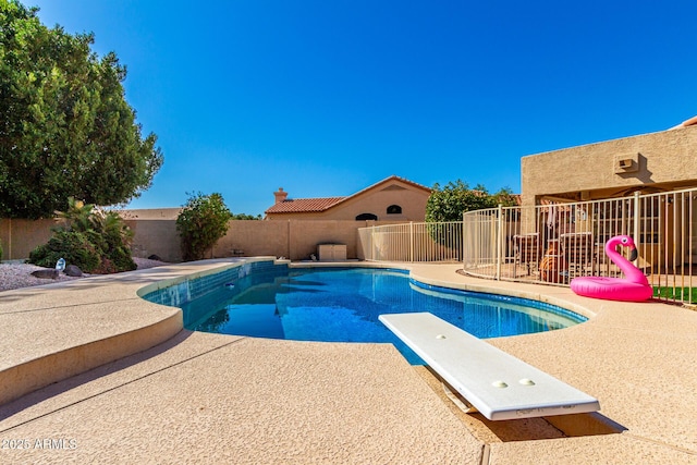 view of swimming pool with a patio area, a fenced in pool, and a fenced backyard