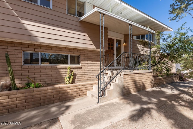 entrance to property with brick siding