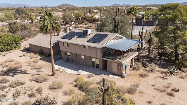 aerial view with a desert view and a mountain view