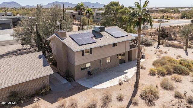 birds eye view of property with a mountain view