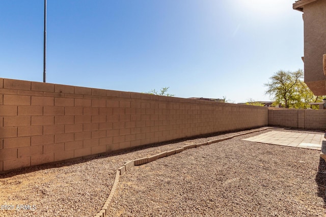 view of yard with a fenced backyard and a patio