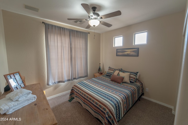 bedroom featuring ceiling fan and light colored carpet