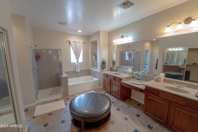 bathroom featuring plus walk in shower, tile patterned floors, and vanity