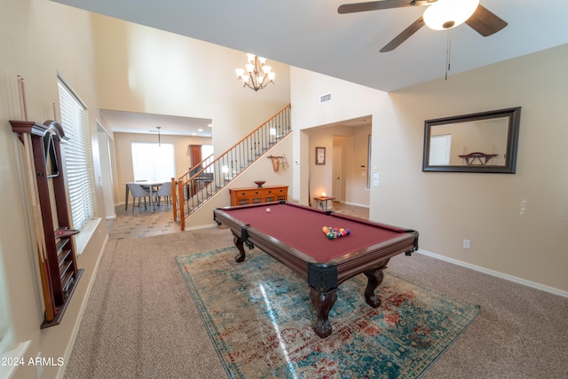 recreation room with light carpet, ceiling fan with notable chandelier, billiards, and a towering ceiling