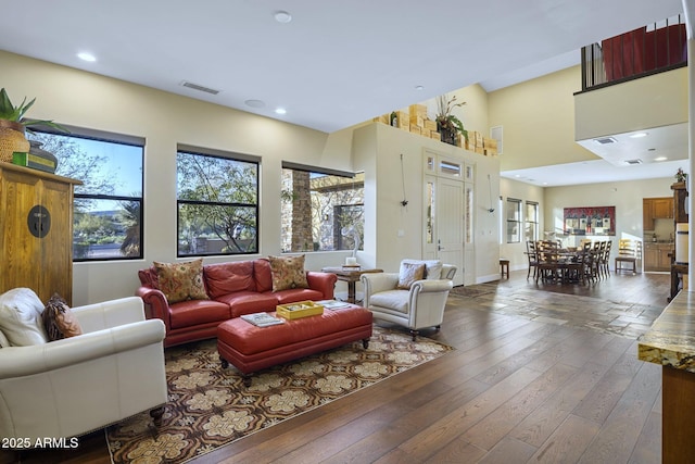36389 N 105th Pl, Scottsdale, AZ 85262 - living room featuring wood-type flooring, recessed lighting, a high ceiling, and baseboards