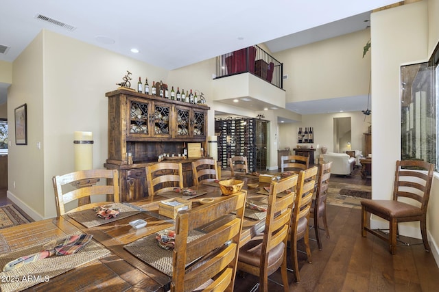 36389 N 105th Pl, Scottsdale, AZ 85262 - dining room featuring hardwood / wood-style floors, a high ceiling, baseboards, and recessed lighting