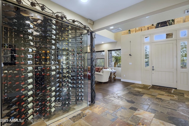 36389 N 105th Pl, Scottsdale, AZ 85262 - wine room with baseboards, stone tile floors, and recessed lighting