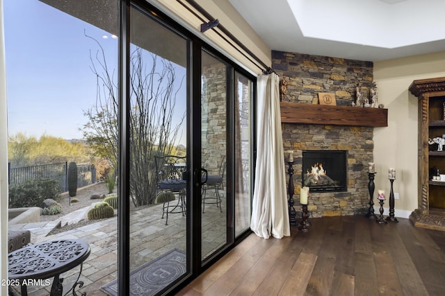 36389 N 105th Pl, Scottsdale, AZ 85262 - doorway with a stone fireplace and dark wood-style floors