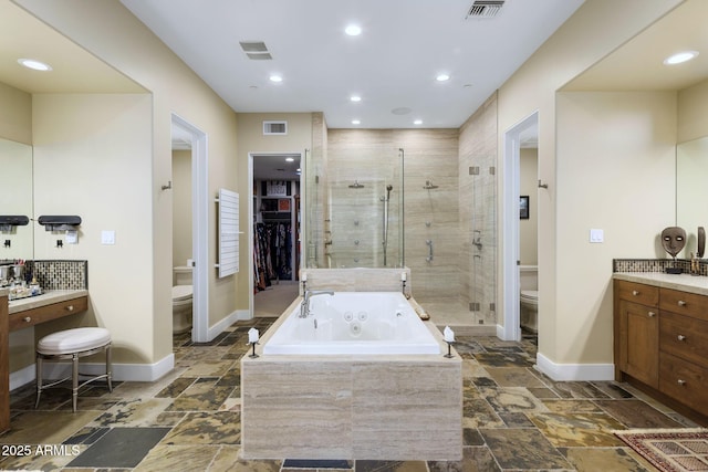 36389 N 105th Pl, Scottsdale, AZ 85262 - full bathroom featuring toilet, stone tile floors, a stall shower, and recessed lighting