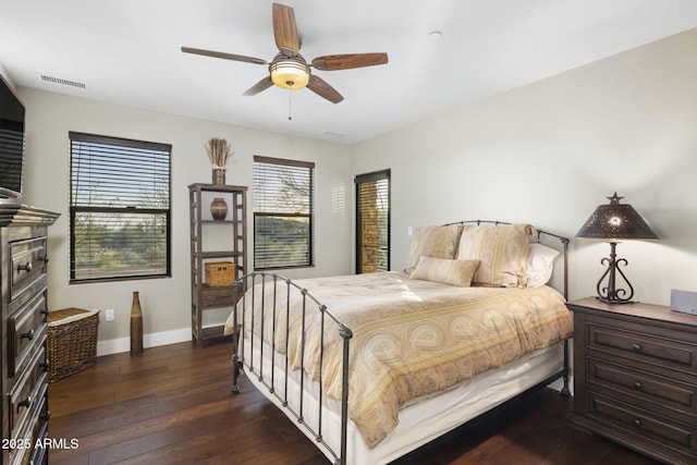 36389 N 105th Pl, Scottsdale, AZ 85262 - bedroom with dark wood-style flooring, baseboards, and ceiling fan