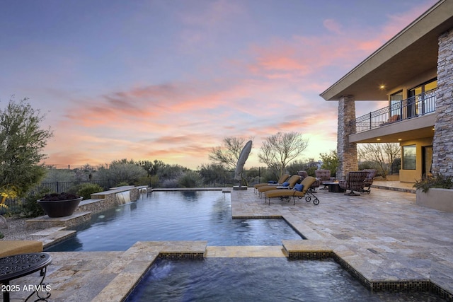36389 N 105th Pl, Scottsdale, AZ 85262 - pool at dusk with a patio area and a pool with connected hot tub
