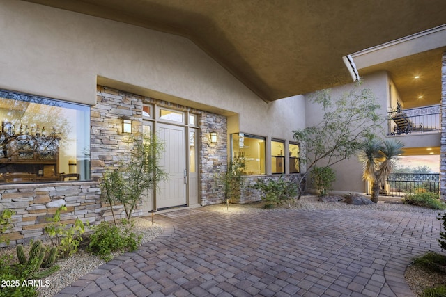 36389 N 105th Pl, Scottsdale, AZ 85262 - doorway to property featuring stone siding, stucco siding, and a patio area