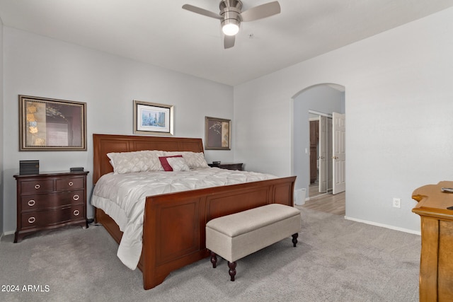 bedroom featuring light carpet and ceiling fan