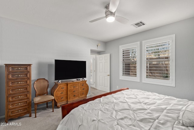 bedroom featuring light colored carpet and ceiling fan