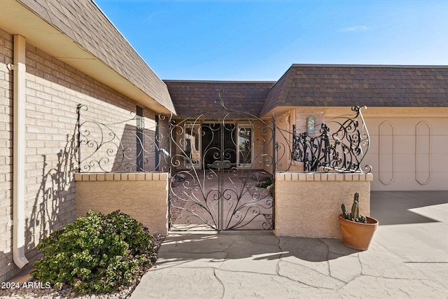 view of gate featuring a garage