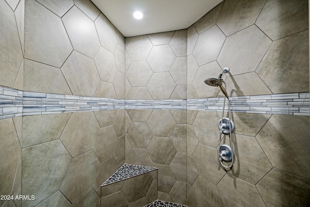 bathroom with a tile shower