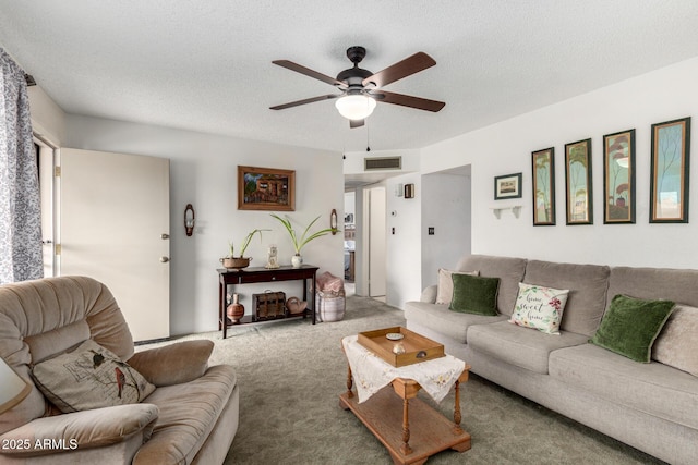 carpeted living room with visible vents, a textured ceiling, and ceiling fan