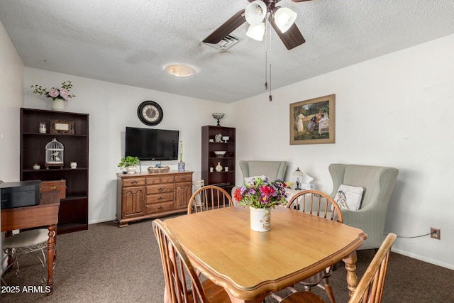 carpeted dining space featuring a textured ceiling, baseboards, visible vents, and ceiling fan