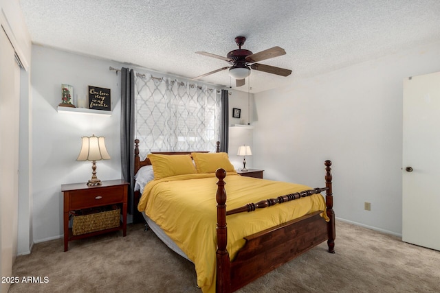 carpeted bedroom featuring a ceiling fan, a closet, and a textured ceiling