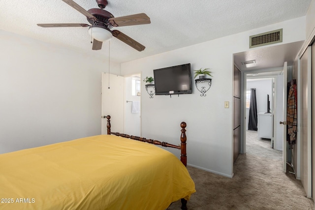 unfurnished bedroom featuring baseboards, visible vents, carpet floors, ceiling fan, and a textured ceiling