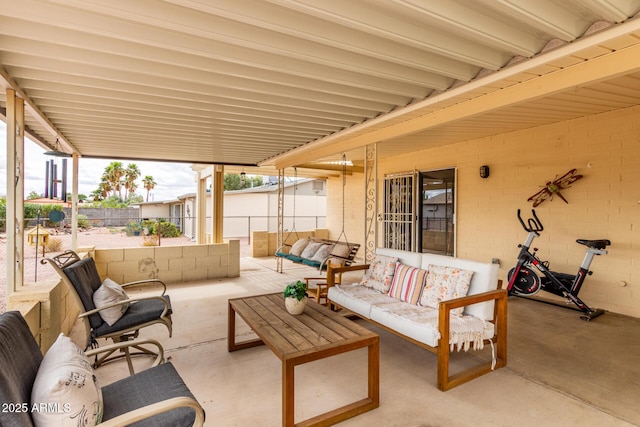 view of patio / terrace with outdoor lounge area and fence