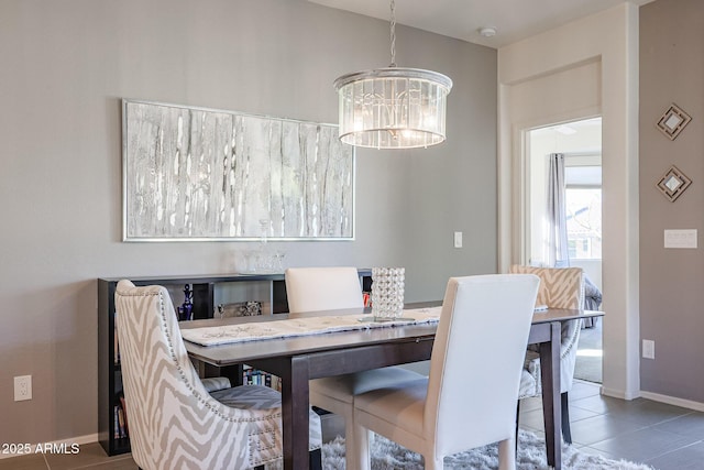 dining room with a notable chandelier