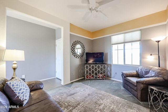 carpeted living room with ceiling fan